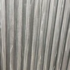 Close-up view of Dark Grey WPC wall panels with 4-track louver profile