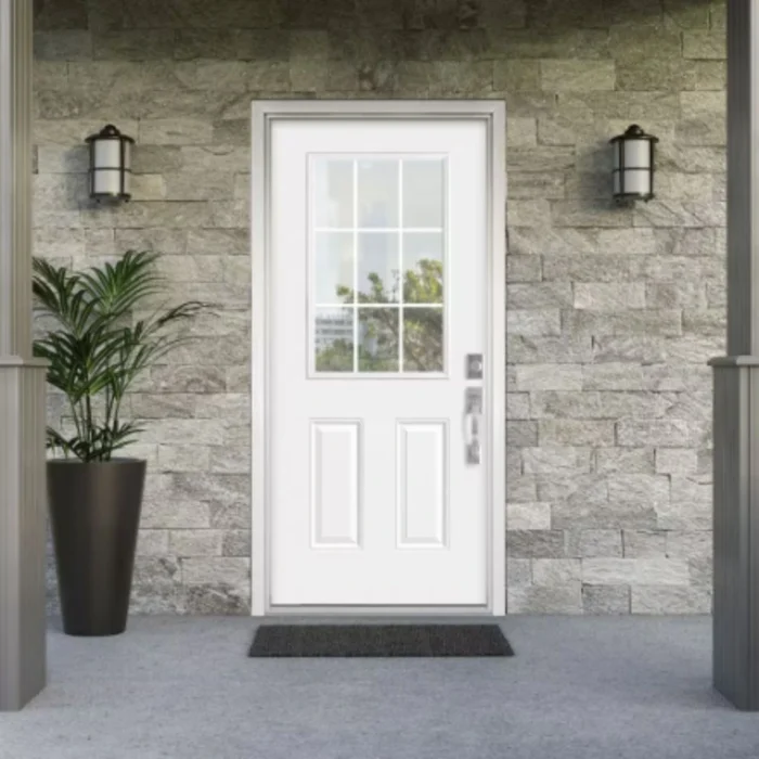 Installed 9 Lite Over 2 Panel Clear Glass Steel Exterior Door in residential entryway