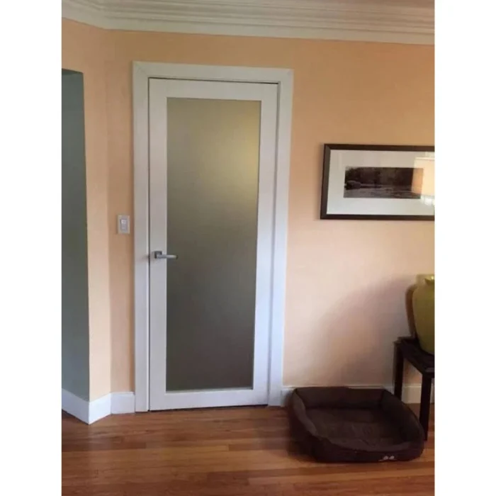 Interior solid core frosted glass door installed in residential hallway