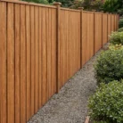 Contractor Installing Pressure Treated 1x6 Premium Wood Fence Boards