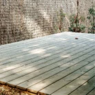 Older installed pressure treated 2 x 6 brown lumber deck and fence project